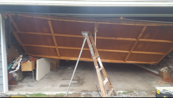 Damaged Garage Falling Off