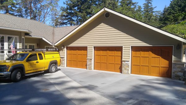 Three Door Garage with Work Truck