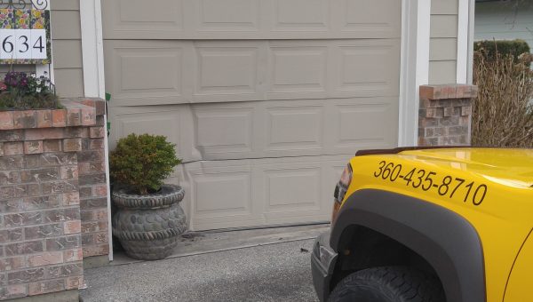 Dented & Cracked Garage Door